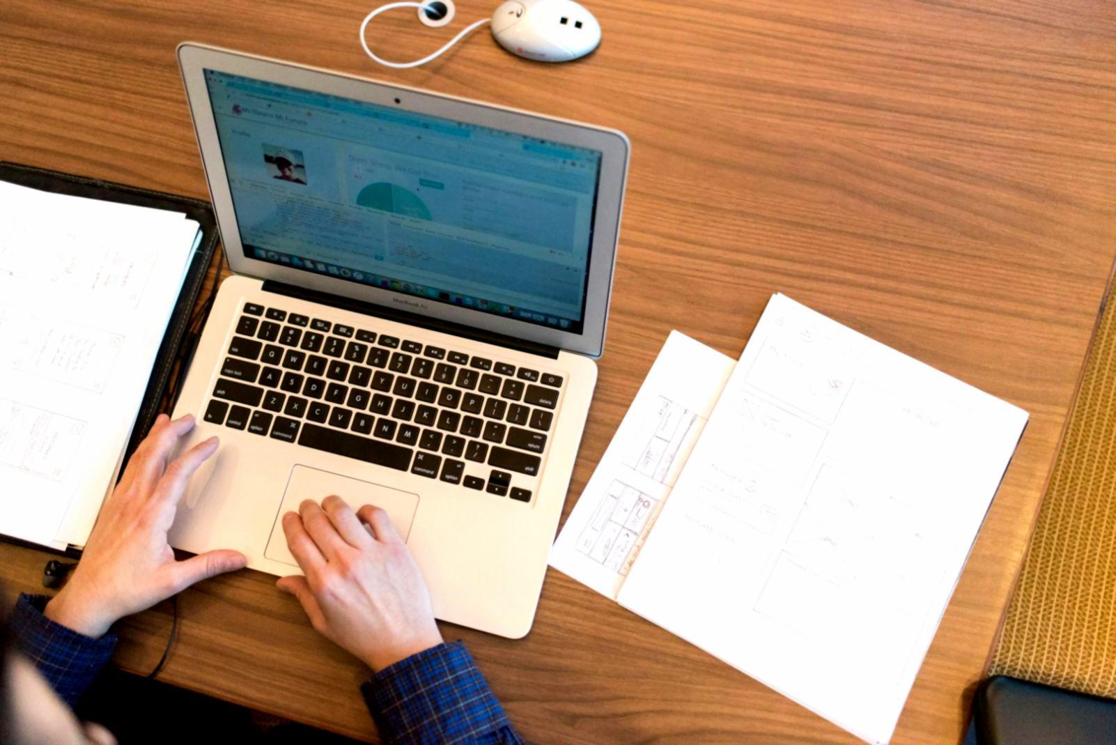 Financial analysts working with budget variance data and charts